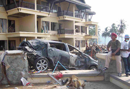 In Phuket, a wrecked car stood as testimony to the damage caused by the Tsunami.
